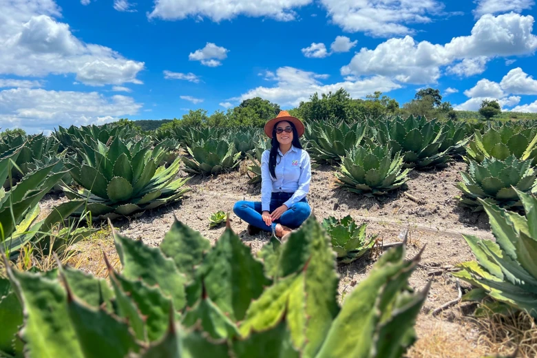 Fernanda Meneses sitting in an agave field in Mexico
